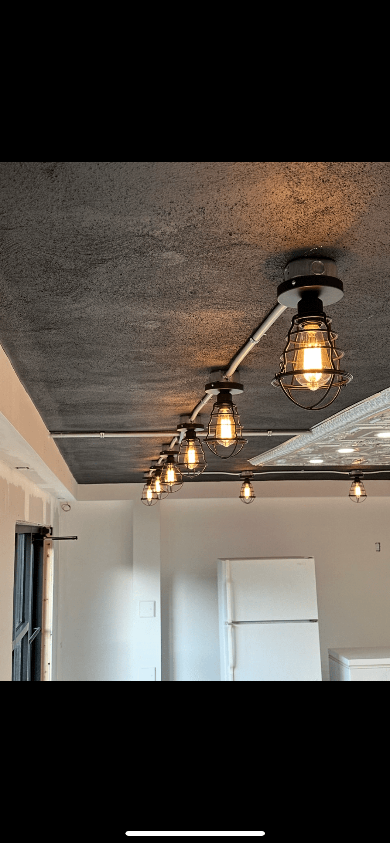 Close-up of commercial cage lighting installed by Mikaly Electric